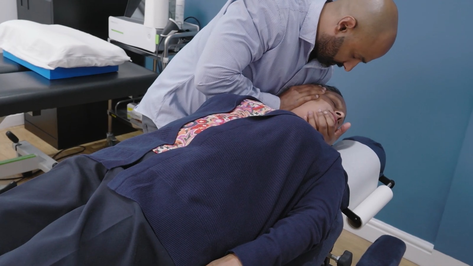 Woman getting a chiropractic adjustment